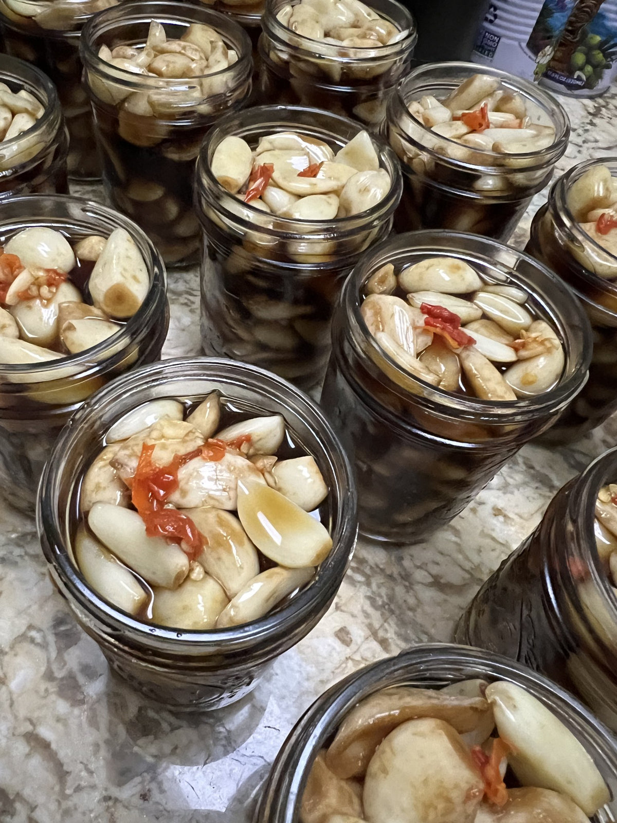 Jars of Momi'snacks pickled garlic